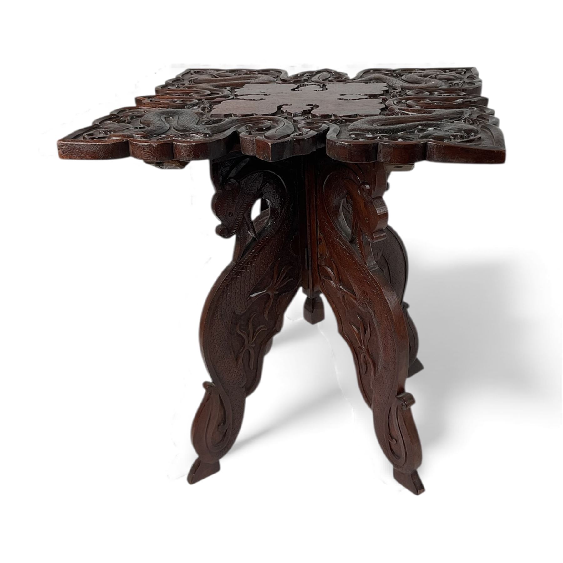 Eastern hardwood folding occasional table, carved with dragons