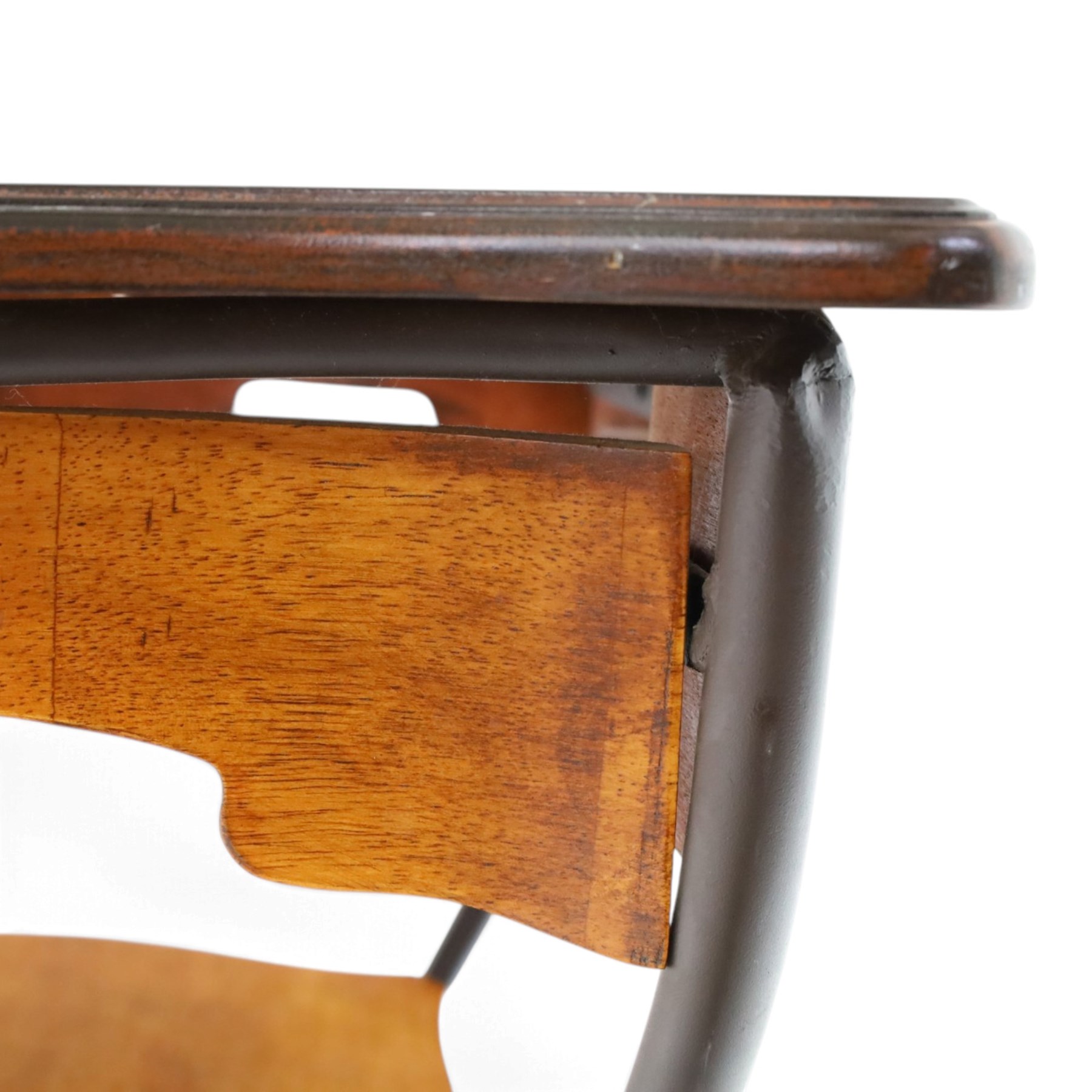 Art Nouveau style occasional table, serpentine shaped top with dark moulded edge, shaped apron and lower shelf, raised on four curved metal supports