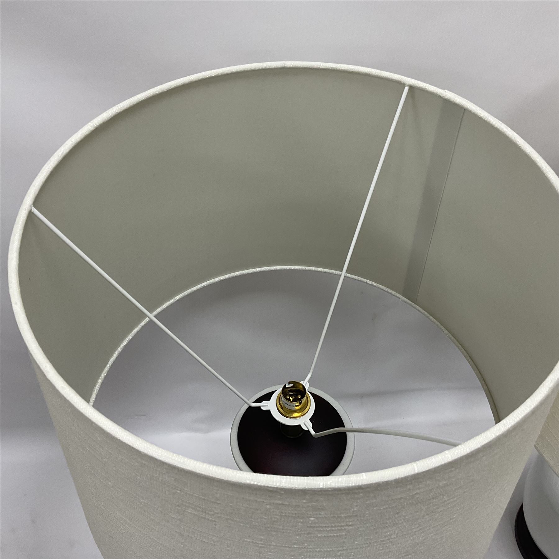 Pair of Chinese ivory crackle glazed table lamps, each of bottle form, raised upon circular hardwood base, excluding fittings H43cm