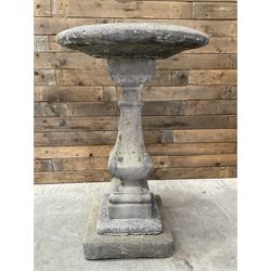 Cast stone garden bird bath, circular dished top, raised on square tapering column, on stepped base with separate mounting plinth