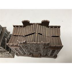 Five early 20th century cast-iron money banks as buildings - 'City Bank' c1904 H10cm; 'County Bank' c1905 H11cm; 'Town Hall Bank' c1900 H8.5cm; 'Tower Bank' c1902 H23.5cm; all made by John Harper; and 'Blackpool Tower Bank' c1907 by Chamberlain & Hill H18.5cm (5)