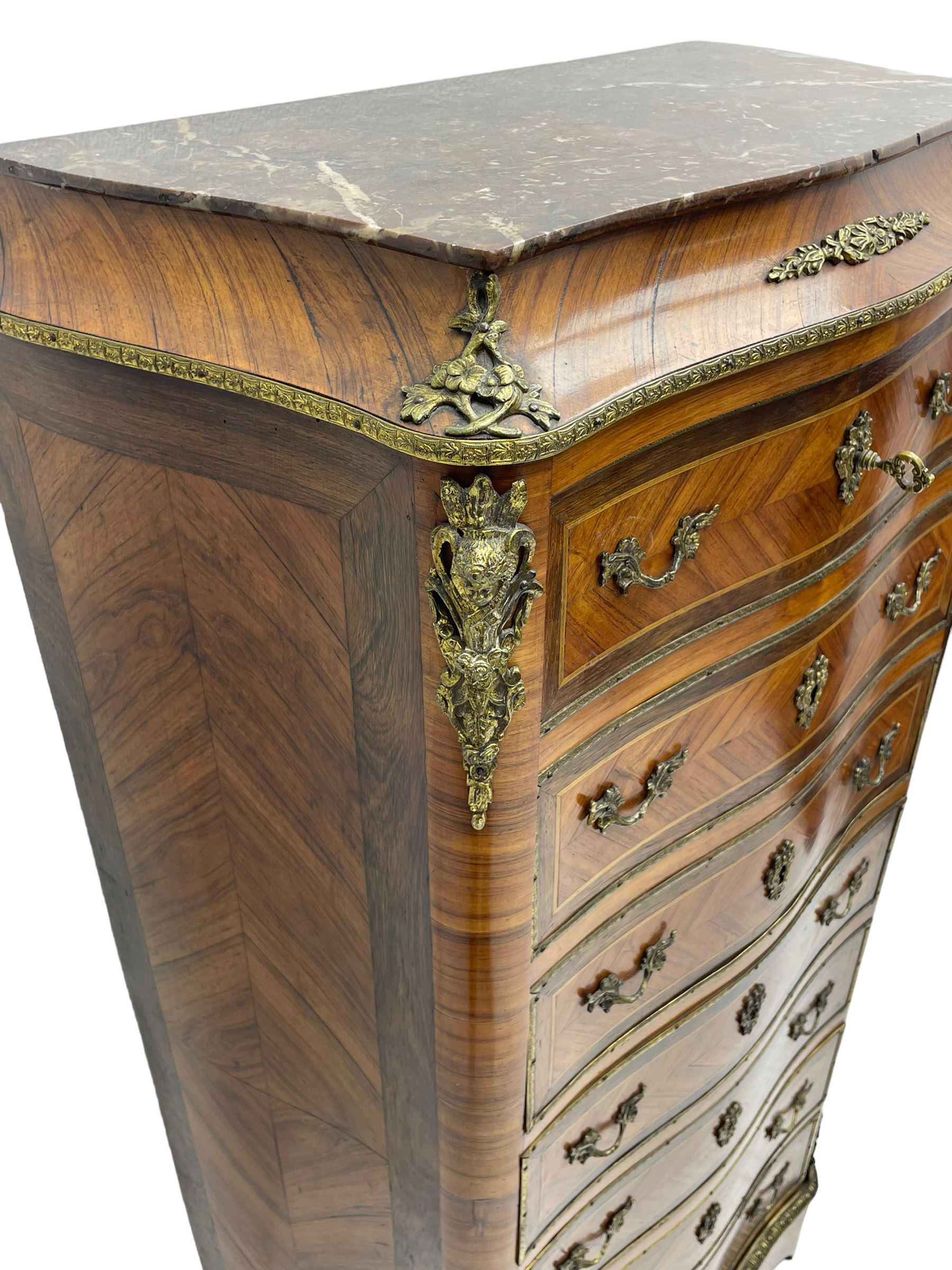Mid-20th century Louis XVI design Kingwood and walnut secretaire à Abattant, shaped serpentine form with dark rouge variegated marble top, the fall front disguised as three drawers enclosing birdseye maple interior with shelf, drawers and writing surface, four functioning drawers below, decorated with cast gilt metal mouldings and mask cartouches, on skirted base with egg and dart moulded gilt metal edge