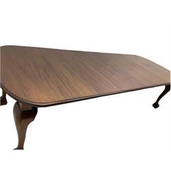 Early 20th century mahogany dining table, fixed moulded top with curved end, on cabriole supports with ball and claw feet with castors