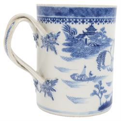 Large 18th century Chinese export blue and white tankard, of cylindrical form with foliate mounted strap handle, the body painted with a riverside landscape with pagodas, willows and pine trees, beneath a cell and spear head band to rim, H14cm D10.5cm