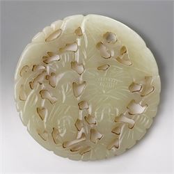 Two carved greenstone roundels, one carved with figures, the other with a dragon, D5.5cm (2)