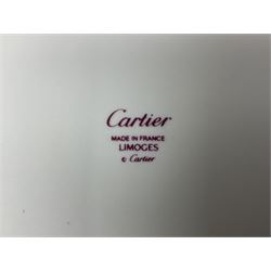 Limoges for Cartier, ceramic trinket dish, of rectangular form with rounded corners, decorated to centre with leopard upon a blue ball, with blue and gilt rim, with printed mark beneath, in original box, H15.5cm, W21cm