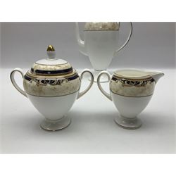 Wedgwood Cornucopia coffee service for six, comprising coffee pot, milk jug, twin handled covered sucrier, coffee cans and saucers