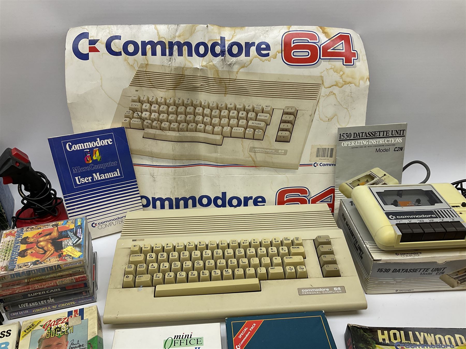 Commodore 64 games computer with boxed 1530 Datassette Unit Model C2N, two joysticks, over seventy games and twenty-two Commodore magazines; polystyrene box inner and card slip-case