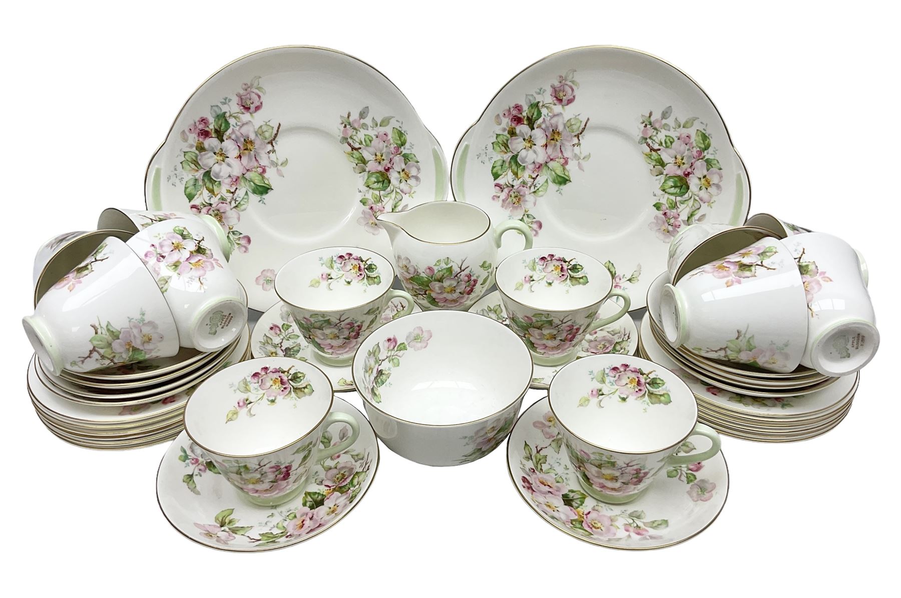Royal Doulton Apple Blossom pattern tea service for twelve, comprising twelve saucers, twelve tea plates, twelve teacups, milk jug, sucrier and two cake plates