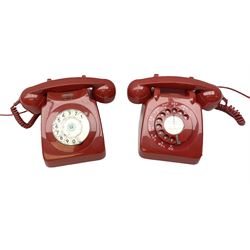 Two mid 19th century red telephones with rotary dials, comprising example marked G.P.O Batch Sampled 8532 706L AEG 67/2A, with junction box marked G.P.O, and another with chrome dial marked P.O Authorised Release 21034 746F EET 78/2
