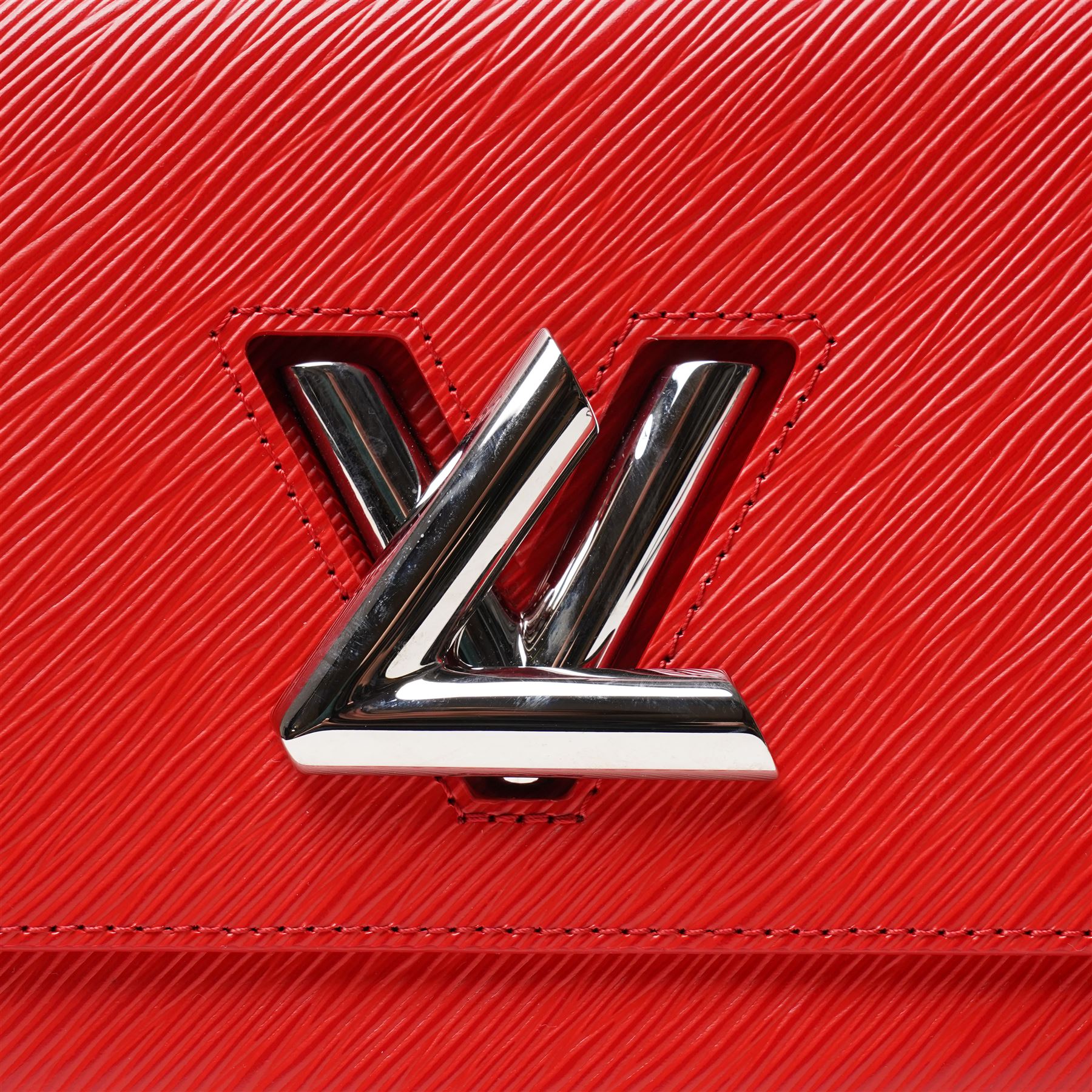 Louis Vuitton - ‘Twist’ MM Bag, the model introduced for the Cruise 2015 collection under Nicolas Ghesquière, in structured Coquelicot red Epi leather, with silver-tone LV twist-lock fastening and chain and carrying handle, with detachable flat leather shoulder or crossbody strap, unused with original box and dust bag
