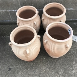 Set four ribbed terracotta urns with three handles, H51cm