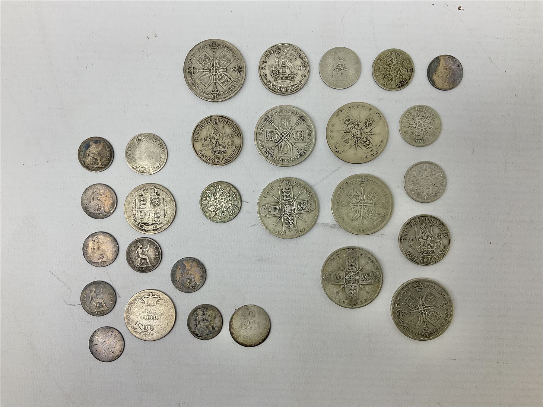 Approximately 28 grams of pre 1920 silver coins including four pence pieces and approximately 120 grams of pre 1947 silver coins including 1926 halfcrown etc