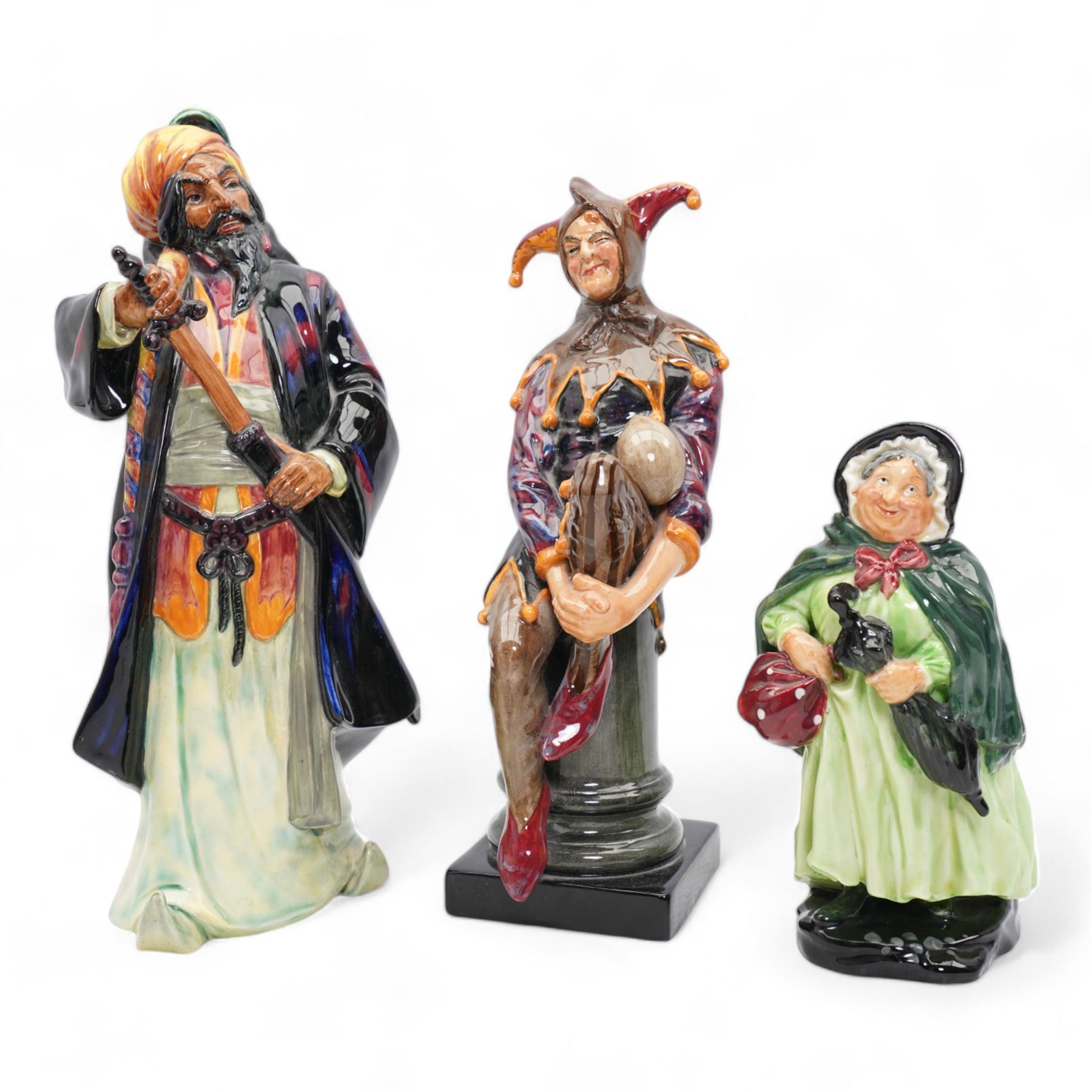 Three Royal Doulton figures comprising 'Sairey Gamp' HN1896, 'The Jester' HN2016 and  'Blue Beard' HN2105 (3)