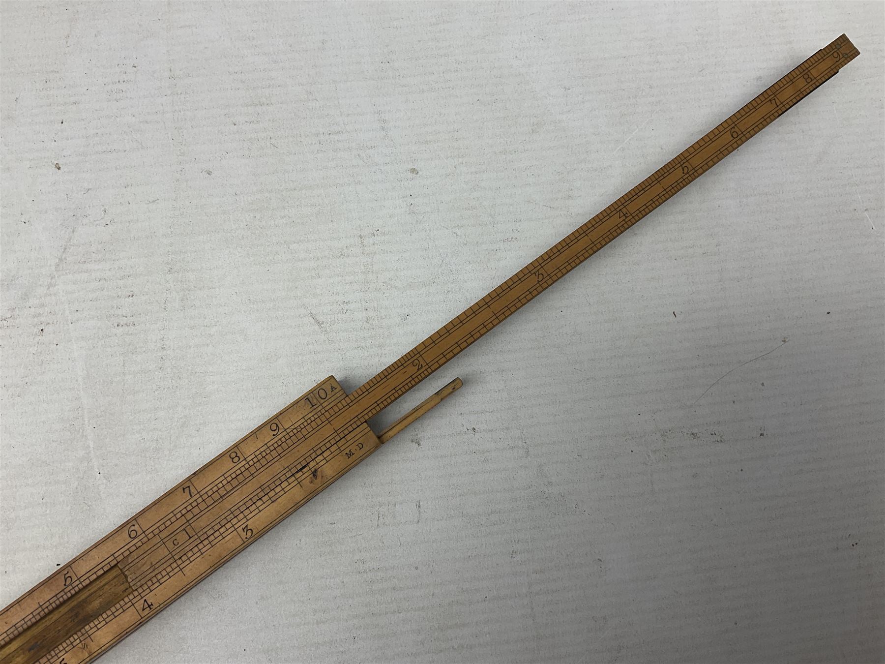 Late 18th/early 19th century boxwood ruler with four slides, for use by Customs &. Excise in the brewery trade; scales on all four sides each having a central slide with divisions on either side;  possibly made by 'E. Roberts, Dove Court, Old Jewry, London' (Edward Roberts (I) 1749-1776 & Edward Roberts (II) 1788-1795) L30.5cm