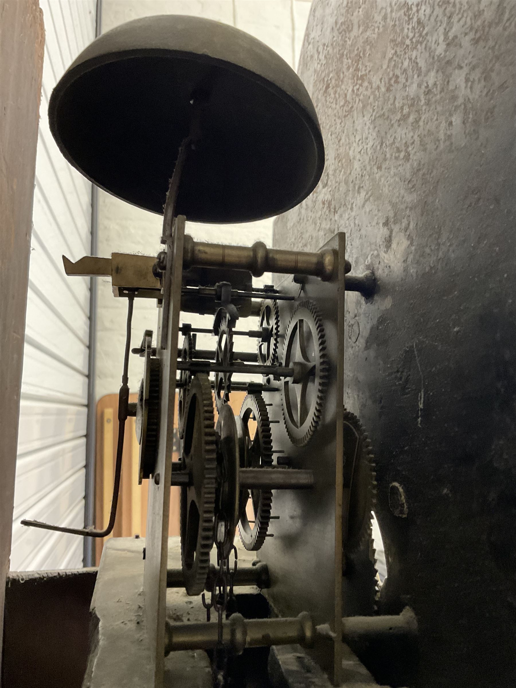 Robert Kneeshaw of Stokesley - 19th century 30 hour mahogany cased longcase clock c1820. with a swans necked pediment and brass paterie, break arch hood door with plain pilasters, inlaid trunk with canted corners, inlay and a wavy topped door, on a rectangular plinth with a shaped base, painted dial with floral spandrels and a depiction of a lady walking in the countryside, with Arabic numerals, non-matching steel hands, calendar aperture and an image of a bird of paradise to the centre, chain driven countwheel striking movement, with weight and pendulum.  