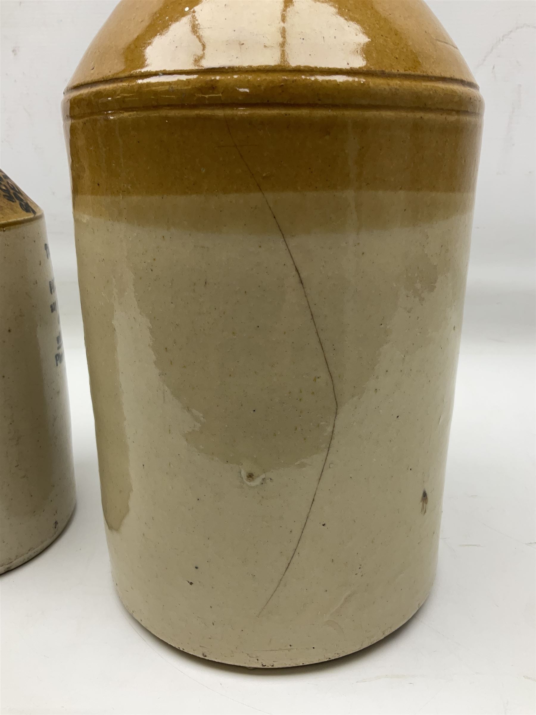Early 20th century stoneware advertising flagon, marked to front 'Pickup Bros Botanical Brewers', together with a larger stoneware flagon