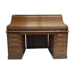 Cutler - early 20th century American oak tambour roll-top desk, the twin pedestals fitted with four graduating drawers
