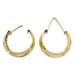 Pair of 18ct gold hoop earrings with textured rose and yellow gold decoration