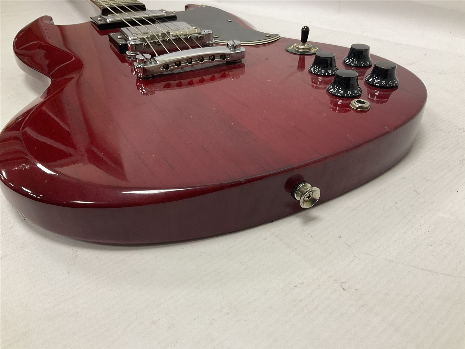 Vintage VS6M Reissued Series six string electric guitar, with solid body in cherry red finish, in carrying case, guitar L103cm