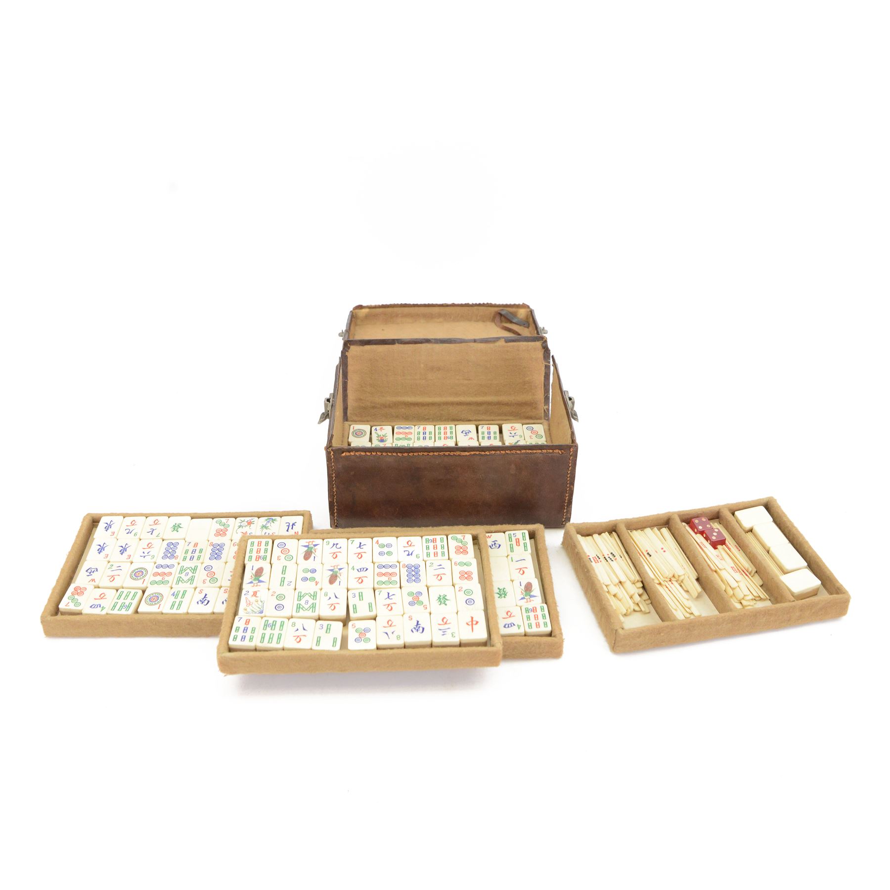 20th century Chinese Mahjong set, with five trays containing bone counters and tiles, contained within a leather bound travelling case with embossed detailing