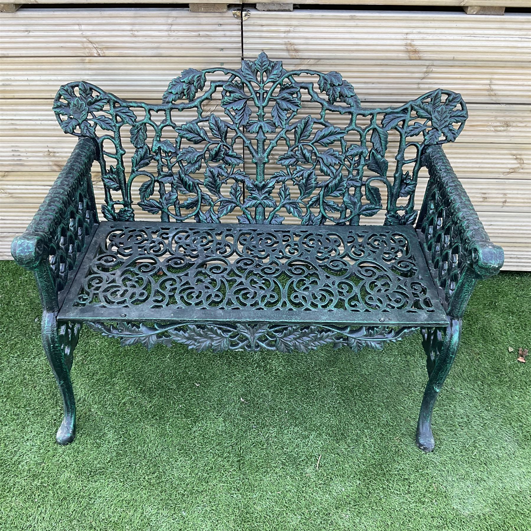 Victorian design heavy cast iron garden bench, ornate shaped back with rope twist and ramshead arms H88cm, W100cm - THIS LOT IS TO BE COLLECTED BY APPOINTMENT FROM DUGGLEBY STORAGE, GREAT HILL, EASTFIELD, SCARBOROUGH, YO11 3TX