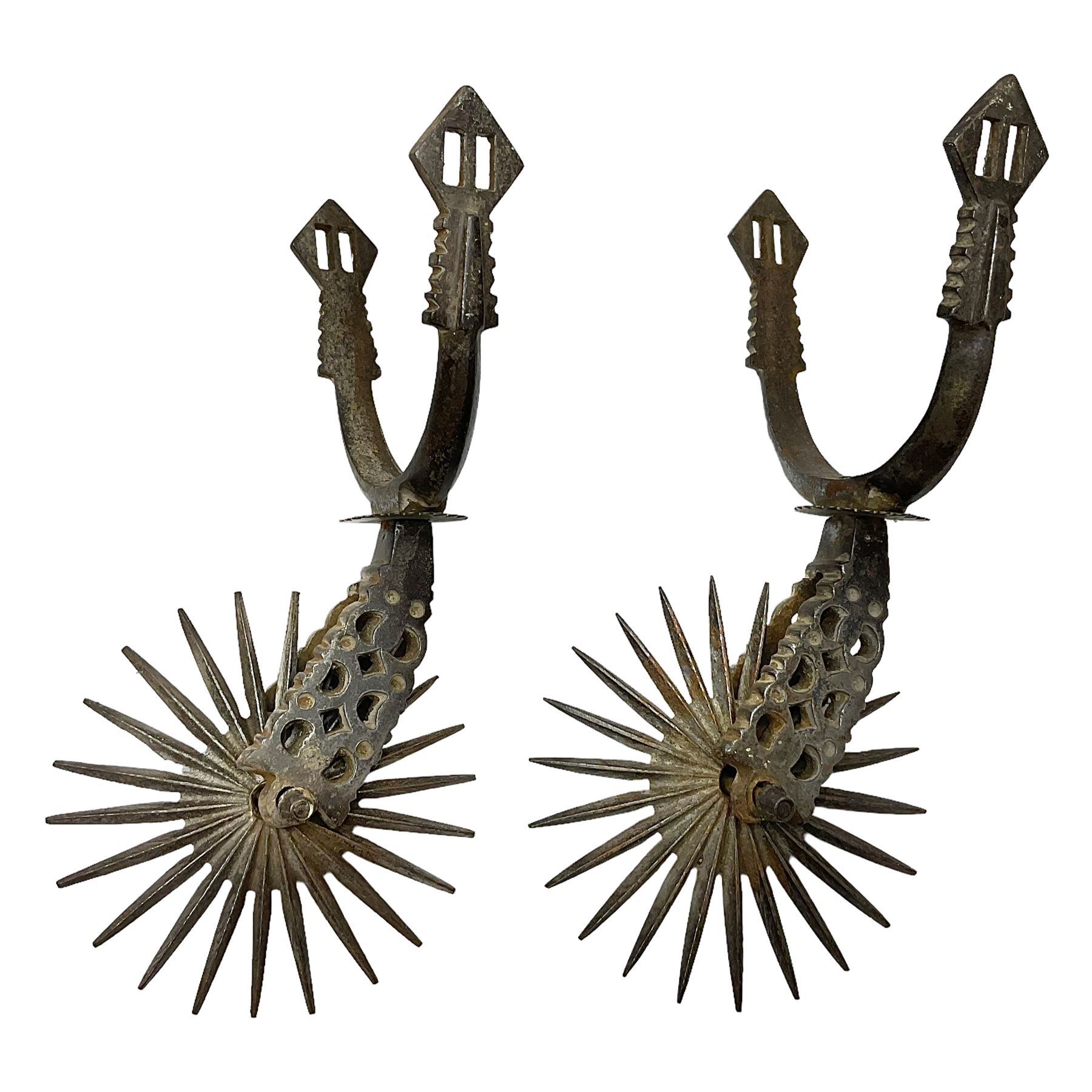 Pair of South American gaucho steel and brass spurs with twenty-two spike heel rowels, possibly Chilean L23cm