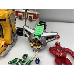 Collection of early 90s Mighty Morphin’ Power Rangers Zords, figures and accessories. Titanus the Carrier Zord, marked Bandai 1991; Green Dragonzord, incomplete; 1994 White Tigerzord with original instruction manual; 1993 Triceratops Dinozord, Mastodon Dinozord and Sabertooth Tiger Dinozord, Pterodactyl Dinozord, missing guns; with 1993 Power Morpher and original Power Coins, with further related figures, accessories and weapons