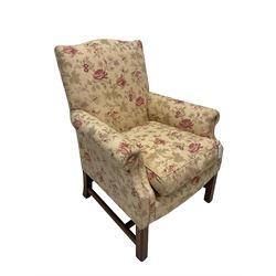 Peter Dudgeon - Georgian design mahogany framed armchair, shaped cresting rail over sprung back and seat flanked by rolled arms, upholstered in floral patterned fabric with matching seat cushion, on square supports joined by stretchers
Provenance: From the Estate of the late Dowager Lady St Oswald