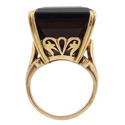 Large gold rectangular smoky quartz ring, with foliate design gallery and scroll shoulders