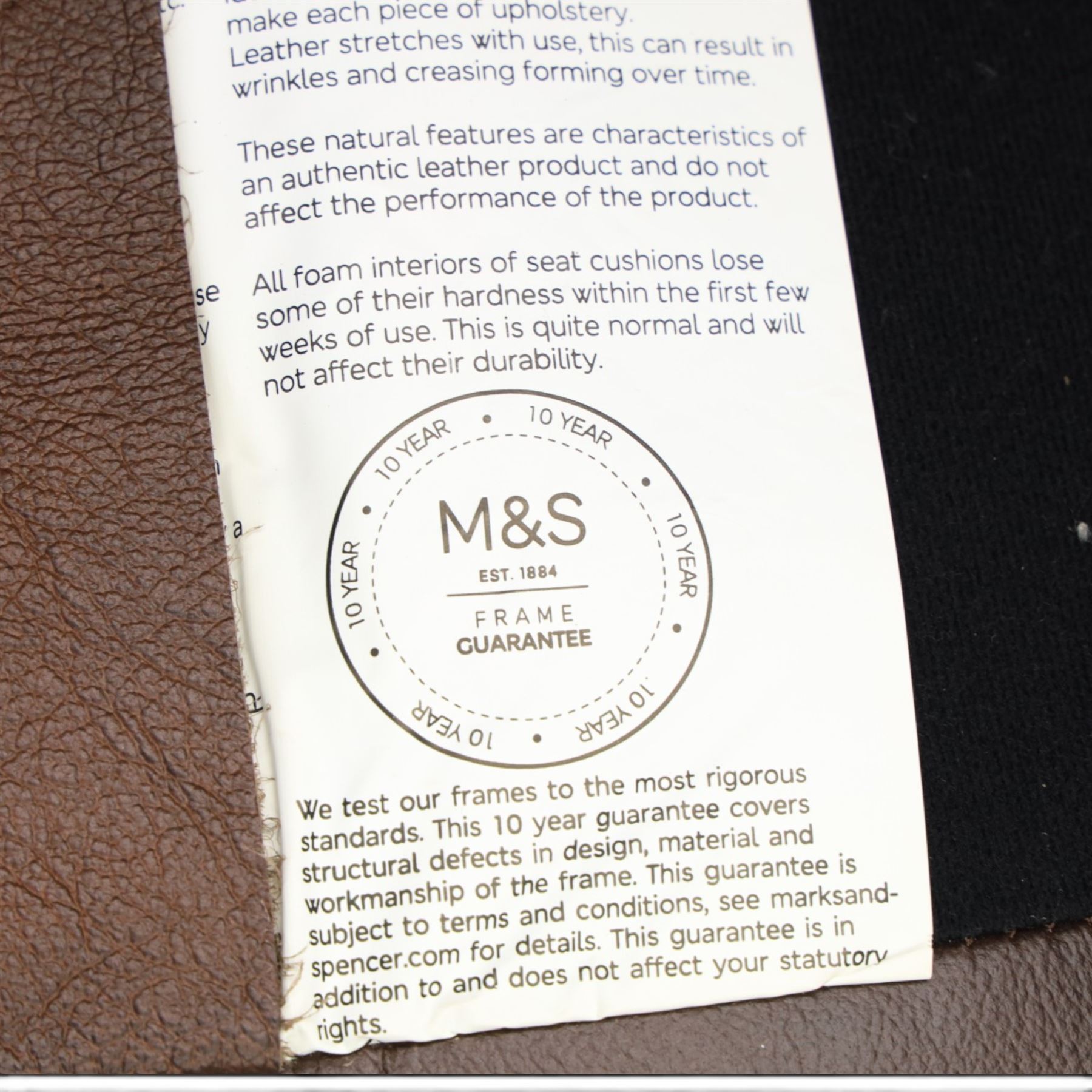 Marks & Spencer - Pair of brown leather wing back chairs, raised on light stained supports with castors