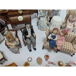 Dolls house drawing room furniture, including dressers, pink and green checked sofa and armchairs, bureau, chairs, piano, eight figures and a collection of afternoon tea miniatures