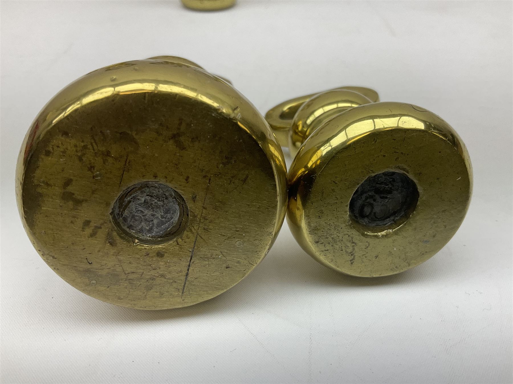 Graduated set of eight brass bell weights, together with a set of five graduating weights (13)