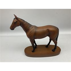 Beswick 'Mill Reef' horse figure, on a wooden plinth together with Beswick Ware horse figure 'Red Rum' on wood plinth, both with printed mark beneath