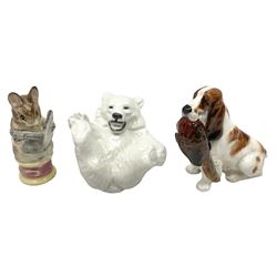 Royal Doulton Spaniel, seated with pheasant in mouth, HN1029, together with a Royal Copenhagen Polar Bear cub, and a Beswick Beatrix Potter Tailor of Gloucester figure. 