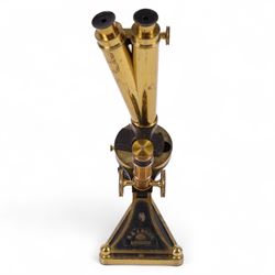 19th century brass binocular microscope by R&J Beck, London, numbered 5527, with rack and pinion focusing, with four eye pieces and three objective lenses, in wooden case