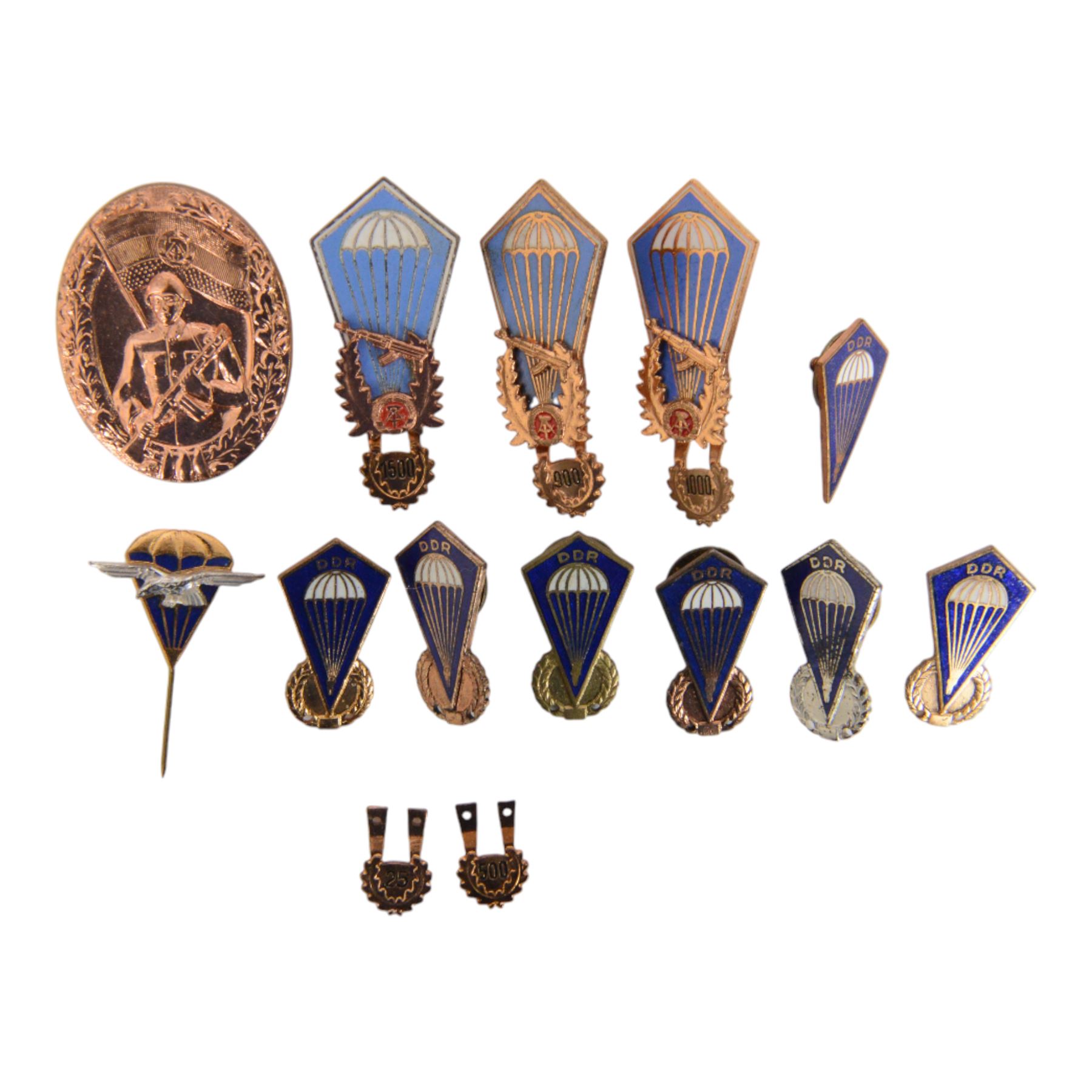 Collection of East German army parachutist metal insignia

