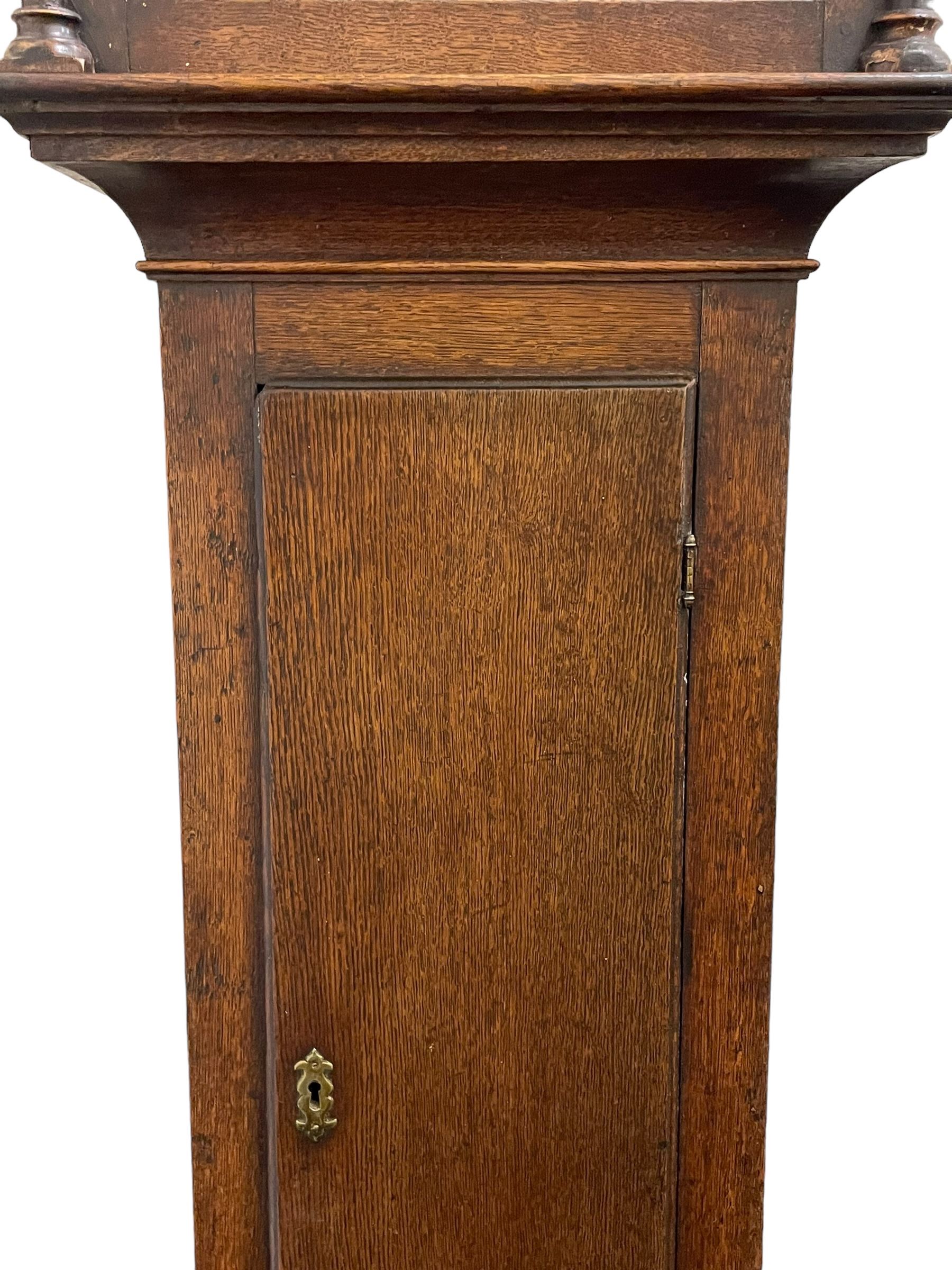 Gilbert Kidd of Malton (North Yorkshire) - late 18th century oak 8-day longcase clock c1780,  with a tall double caddy top and later brass ball and spire finials, break arch hood door beneath with attached pilasters and wooden capitals,  plain trunk with a long flat topped door, raised on a square plinth with applied skirting,  brass break arch dial with the makers name to the silvered boss in the break arch, engraved and silvered dial centre and chapter ring, with cast spandrels and matching steel hands, subsidiary seconds dial and square calendar aperture, dial pinned directly to a rack striking movement with a recoil anchor escapement, sounding the hours on a cast bell. With pendulum and weights.
The Kidd family were a prolific family of provincial clockmakers working in Malton from the mid 18th century until the early 19th century. Many of their clocks are simply signed 
