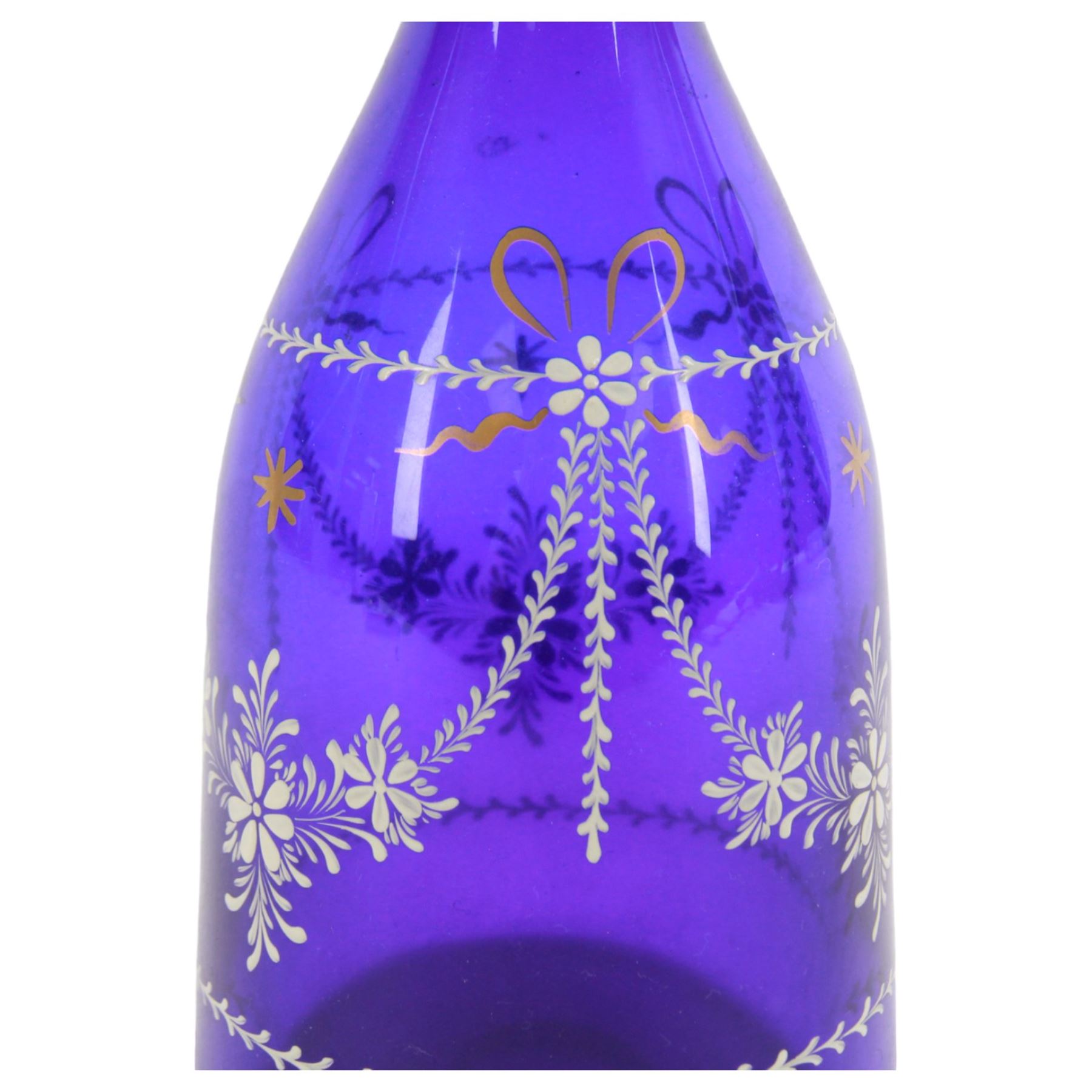 19th century style blue glass decanter and six drinking glasses, the decanter of mallet form with lozenge shaped stopper, all with white enamel and gilt swag decoration, decanter H34cm, drinking glasses H11.5cm