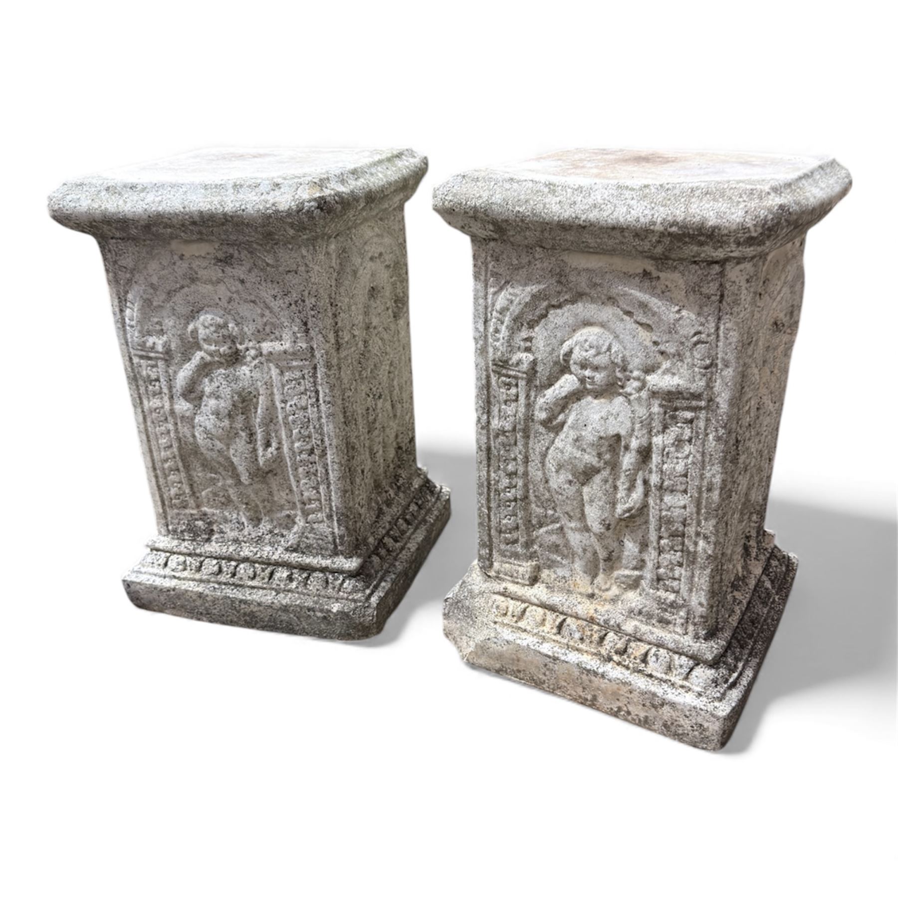 Paid of square cast stone plinths with a classical design