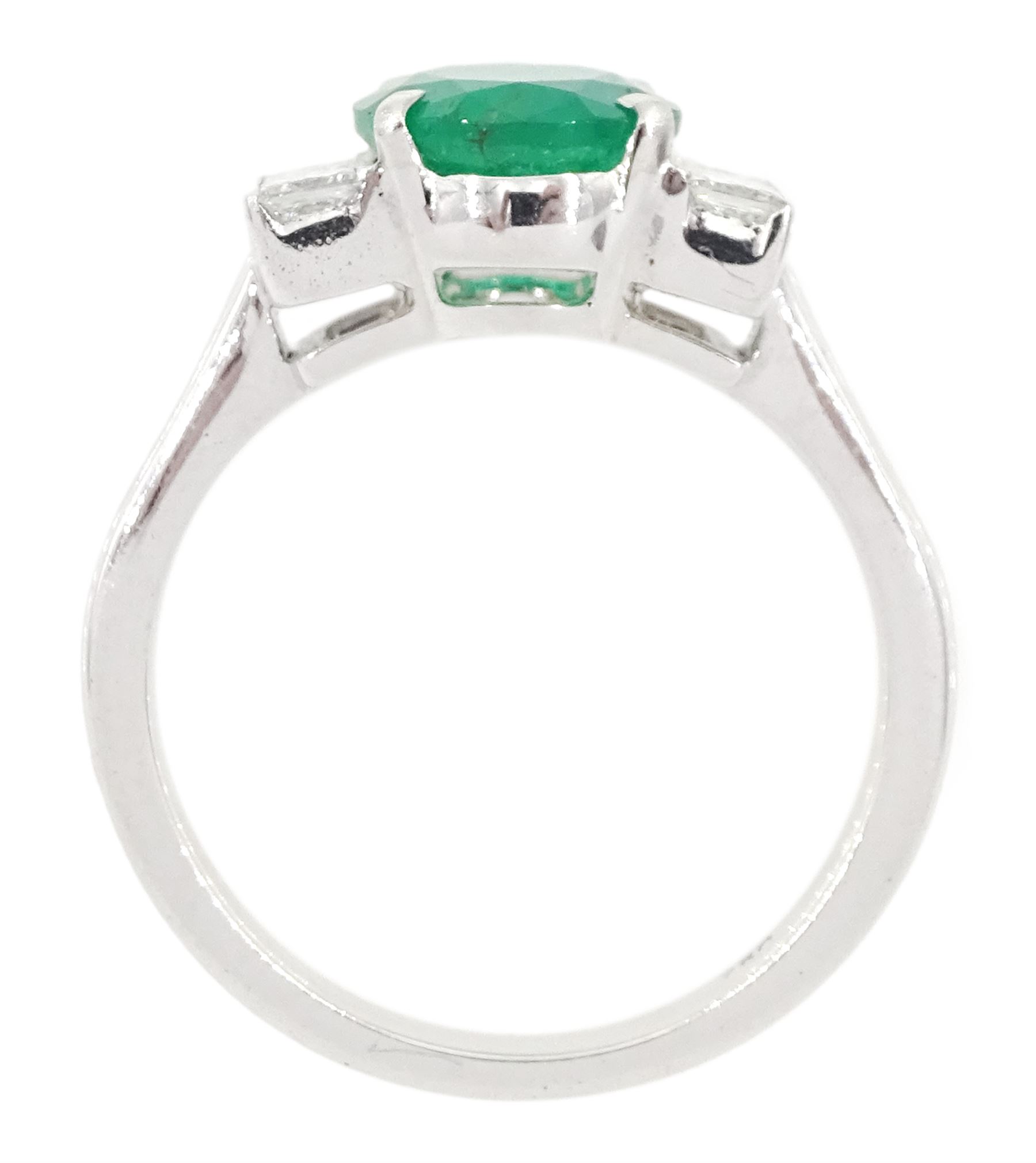 18ct white gold emerald and diamond ring, single oval cut emerald, each side set with three princess cut diamonds, stamped 750, emerald approx 1.90 carat, total diamond weight approx 0.50 carat