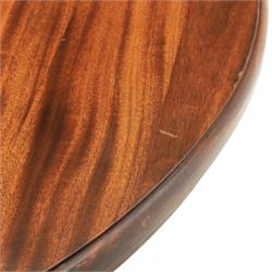 Regency design mahogany extending twin pedestal dining table with two additional leaves, raised on splayed supports terminating brass paw feet
Extends to 268cm