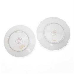 Flight, Barr & Barr Worcester porcelain cabinet plate, centrally painted with two figures admiring the landscape, within a gilt seaweed border, printed marks beneath, D22.5cm, together with a Barr, Flight & Barr Worcester cabinet plate, painted with a view of the River Esk, Scotland', within a peach and gilt seaweed border, titled 'On the River Esk - Scotland' and printed marks beneath (2)