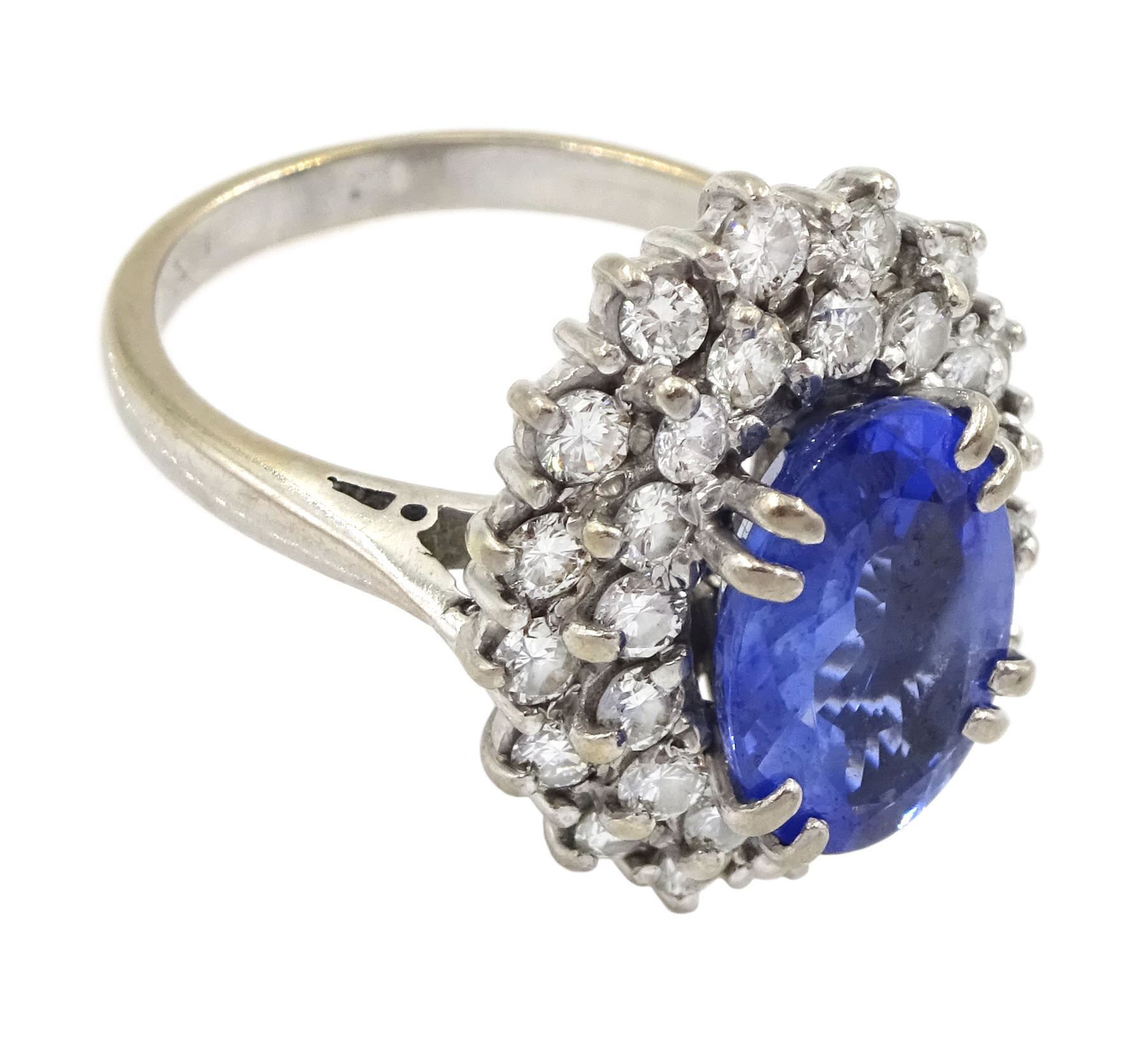 18ct white gold oval sapphire and round brilliant cut diamond cluster ring, Sheffield 2000, sapphire approx 3.75 carat, total diamond weight approx 0.70 carat