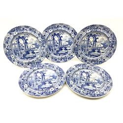 Five early 19th century blue and white pearlware figures, transfer printed with classical scene of figures before an archway and bridge leading to ruins upon a hill, within a floral and lace border, one example with paper label beneath detailed '[...] ex Chapsworth House (Chatsworth?)', D21.5cm. 