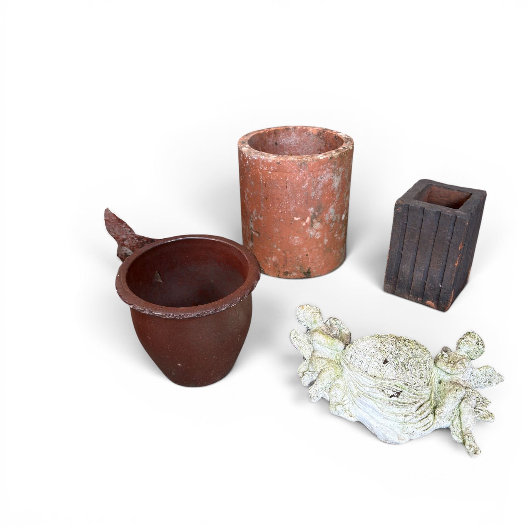 Two Victorian terracotta octagonal squat chimney pots, three other pots, terracotta planter, three small planters, cast iron fox door stop and a cherub wall pocket