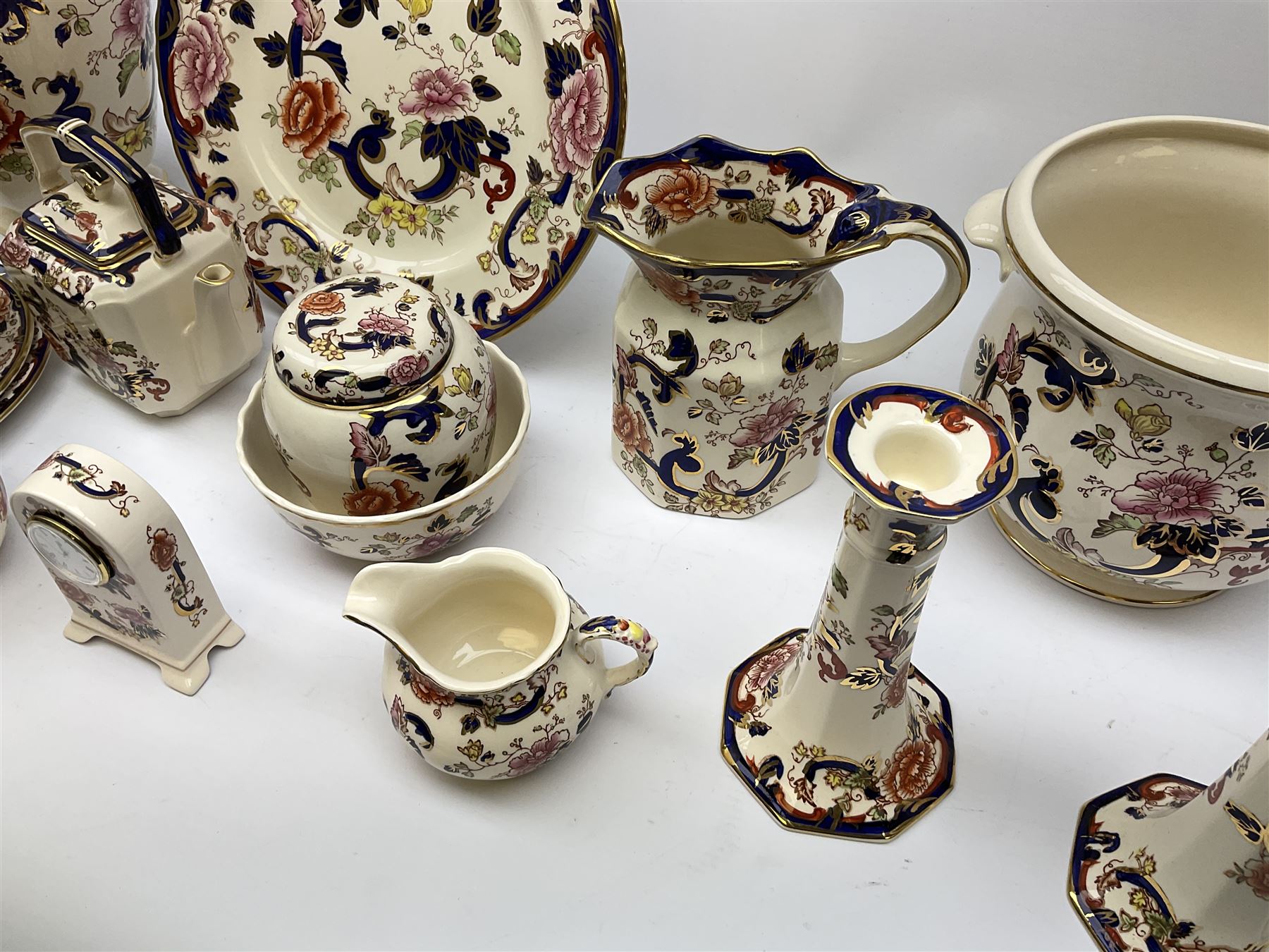 A group of Masons Ironstone Mandalay pattern wares, comprising large vase, planter with twin lug handles, three graduated plates, bowl, teapot, teacup and saucer, jug, smaller jug, open sucrier, small pot and cover, pair of candlesticks, small mantel clock, and pin dish. 