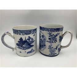 Two large 18th century Chinese blue and white tankards, each of cylindrical form, the first example with foliate mounted strap handle, the body painted with a shaped panel depicting a riverside landscape with pagodas and pine trees, against a textured ground decorated with floral sprays, H15cm D12cm, the second with serpent handle, the body painted with a similar riverside landscape, H14cm D12cm