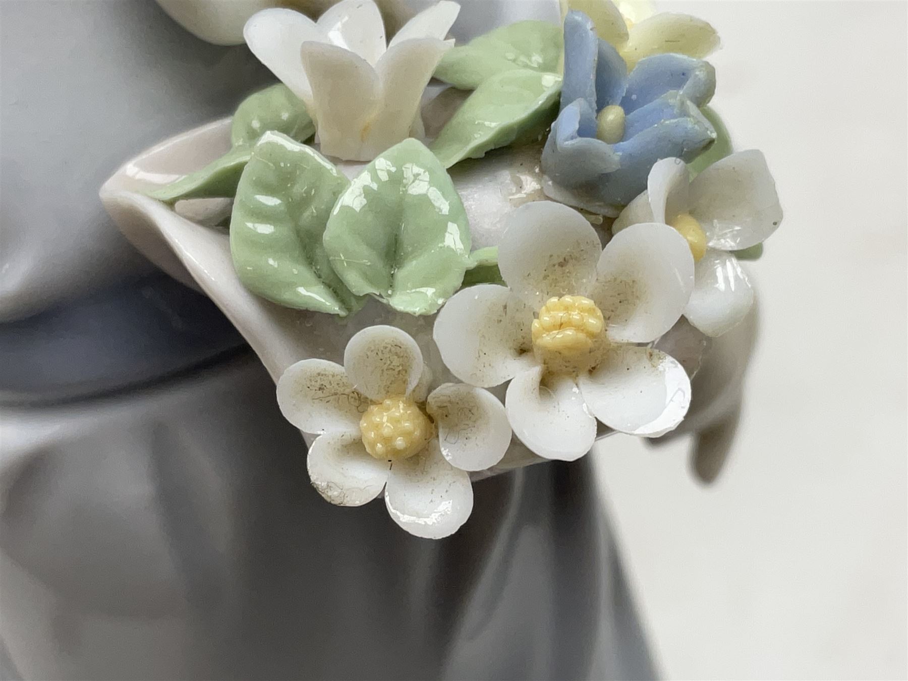 Three Lladro figures comprising, Pocket Full of Wishes no 7650, School Days no 7604 and Spring Bouquets no 7603, all with original boxes, largest example H26cm  