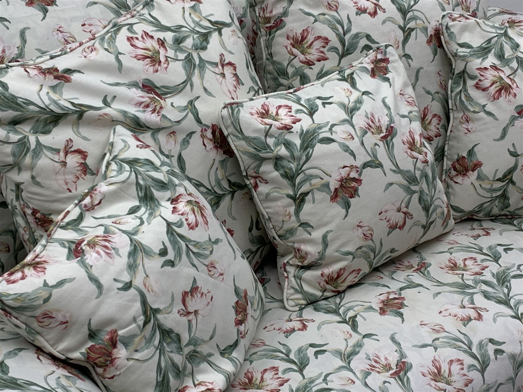 Early 20th century two seat settee with drop arm, upholstered in Sanderson 'Absalon Minor' fabric, loose covers and cushions, white ground with overall floral design